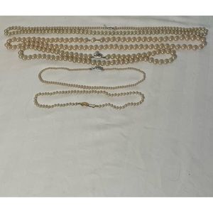 5 faux pearl necklaces.